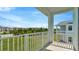 A covered balcony overlooking manicured lawns and neighboring homes at 31869 Anchor Point Dr, Wesley Chapel, FL 33545