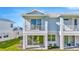 Exterior side view featuring two stories, multiple windows, and a well-kept lawn at 31869 Anchor Point Dr, Wesley Chapel, FL 33545