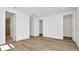 Spacious main bedroom featuring hardwood floors, neutral paint, walk in closet, and an ensuite bath at 31869 Anchor Point Dr, Wesley Chapel, FL 33545