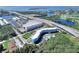 Scenic aerial of blue condo building near a marina and highway, offering convenient access to waterfront and transportation at 3315 58Th S Ave # 314, St Petersburg, FL 33712