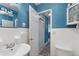 Small white and blue tiled bathroom with a single vanity and toilet at 3315 58Th S Ave # 314, St Petersburg, FL 33712