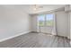 Light and airy bedroom featuring a large window and modern, durable laminate flooring at 3315 58Th S Ave # 314, St Petersburg, FL 33712