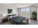 Bright bedroom features a large window, ceiling fan, and contemporary décor at 3315 58Th S Ave # 314, St Petersburg, FL 33712