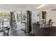 Bright gym with various machines, rubber floors, and large windows at 3315 58Th S Ave # 314, St Petersburg, FL 33712