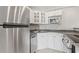 Kitchen featuring stainless steel appliances, white cabinetry, and ample counter space at 3315 58Th S Ave # 314, St Petersburg, FL 33712