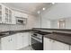 Bright kitchen features sleek countertops, white cabinetry, and modern stainless steel appliances at 3315 58Th S Ave # 314, St Petersburg, FL 33712