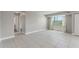Bright living area with tile floors and large windows at 3315 58Th S Ave # 314, St Petersburg, FL 33712