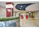 Elegant lobby features modern décor, a lush green planter, and inviting red seating at 3315 58Th S Ave # 314, St Petersburg, FL 33712