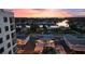 Sunset aerial view captures community, waterfront, and condo with rooftop pool at 4400 37Th S St # 2, St Petersburg, FL 33711