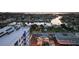 Evening aerial shot showcases waterfront neighborhood with serene canal and boats at 4400 37Th S St # 2, St Petersburg, FL 33711