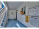 A cozy condo entrance with a blue painted floor and stairs, mailboxes, and door decor at 4400 37Th S St # 2, St Petersburg, FL 33711