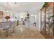 Open layout showcasing updated kitchen with stainless steel appliances and adjacent dining area at 4400 37Th S St # 2, St Petersburg, FL 33711