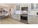 Bright kitchen featuring white cabinets, stainless steel appliances, and stylish countertops at 4400 37Th S St # 2, St Petersburg, FL 33711