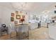 A bright kitchen with stainless steel appliances, modern white cabinets and adjacent dining area at 4400 37Th S St # 2, St Petersburg, FL 33711