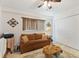 Comfortable living room with a cozy sofa, a unique coffee table, and a large window, creating a welcoming space at 4400 37Th S St # 2, St Petersburg, FL 33711