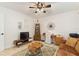 Cozy room with a television, desk, and comfortable seating, perfect for relaxation and entertainment at 4400 37Th S St # 2, St Petersburg, FL 33711
