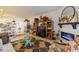 Open-concept living space with stylish decor, custom shelving, and views into kitchen at 4400 37Th S St # 2, St Petersburg, FL 33711