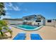 Inviting backyard pool with lounge chairs and outdoor dining area, perfect for relaxing and entertaining at 4400 37Th S St # 2, St Petersburg, FL 33711