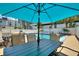 Community pool offers tables with seating and lounge chairs amidst palm trees and condo buildings at 4400 37Th S St # 2, St Petersburg, FL 33711
