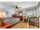 Bright bedroom with natural light, ceiling fan, and hardwood floors at 5005 Parrish Ln, Safety Harbor, FL 34695