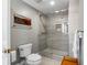 Modern bathroom with a toilet and glass enclosed shower at 555 5Th Ne Ave # 711, St Petersburg, FL 33701