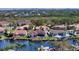 A stunning aerial view highlighting waterfront homes with private docks, pools, and lush landscaping at 6014 Mariners Watch Dr, Tampa, FL 33615