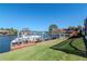 Backyard featuring a gazebo on a dock and a boat lift in the water at 6014 Mariners Watch Dr, Tampa, FL 33615