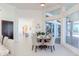Open dining area with a modern table and chairs, lots of natural light and easy access to kitchen and living areas at 6014 Mariners Watch Dr, Tampa, FL 33615