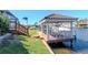 Picturesque waterfront property featuring a covered boat dock and access to the water at 6014 Mariners Watch Dr, Tampa, FL 33615