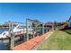 This waterfront property features a private boat dock with a lift, providing easy access to the open water at 6014 Mariners Watch Dr, Tampa, FL 33615