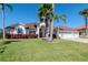 Charming single-story home with a well-manicured lawn and a two-car garage at 6014 Mariners Watch Dr, Tampa, FL 33615