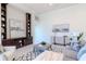 Comfortable living room area with neutral decor, built-in shelving and lots of natural light at 6014 Mariners Watch Dr, Tampa, FL 33615