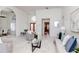 Bright living room with neutral tones, large windows, and modern furnishings at 6014 Mariners Watch Dr, Tampa, FL 33615