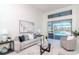 Cozy living room with comfortable seating and sliding glass doors to the pool area at 6014 Mariners Watch Dr, Tampa, FL 33615