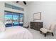 Light-filled main bedroom with a serene view of the pool and access to the screened-in porch at 6014 Mariners Watch Dr, Tampa, FL 33615