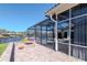 Enjoy outdoor living with a screened-in pool area, fire pit, and waterfront views at 6014 Mariners Watch Dr, Tampa, FL 33615