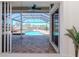 Inviting screened-in pool area with a spa and waterfront views at 6014 Mariners Watch Dr, Tampa, FL 33615