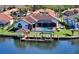 Waterfront home with private dock and screened pool overlooking the water at 6014 Mariners Watch Dr, Tampa, FL 33615