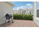 Outdoor space with a charcoal grill and quaint brick patio at 6251 Camino Dr, Apollo Beach, FL 33572