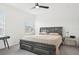 Spacious bedroom featuring a king-sized bed, ceiling fan, and bright natural light at 6251 Camino Dr, Apollo Beach, FL 33572