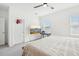 Bedroom featuring large bed, ceiling fan, mounted television, and lots of natural light at 6251 Camino Dr, Apollo Beach, FL 33572