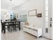 Bright dining area features modern lighting and a view to the outside at 6251 Camino Dr, Apollo Beach, FL 33572