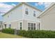 Charming two-story home with manicured landscaping and light blue siding at 6251 Camino Dr, Apollo Beach, FL 33572