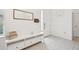 Bright foyer featuring white walls, tile flooring, and decorative accents at 6251 Camino Dr, Apollo Beach, FL 33572