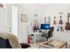 Bright home office setup with monitors, desk, and guitars on the wall for inspiration at 6251 Camino Dr, Apollo Beach, FL 33572