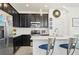 Modern kitchen with stainless steel appliances, sleek countertops, and breakfast bar at 6251 Camino Dr, Apollo Beach, FL 33572