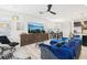 Open-concept living room with large TV and comfortable seating at 6251 Camino Dr, Apollo Beach, FL 33572