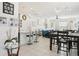 Open-concept living area with modern lighting, tiled floor and bar seating at 6251 Camino Dr, Apollo Beach, FL 33572