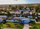 Aerial view of the home, showcasing the backyard, screened pool, and surrounding neighborhood at 6398 17Th N Pl, St Petersburg, FL 33710