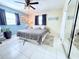 Bedroom featuring a queen bed, tile floors, and bright windows with neutral paint at 6398 17Th N Pl, St Petersburg, FL 33710